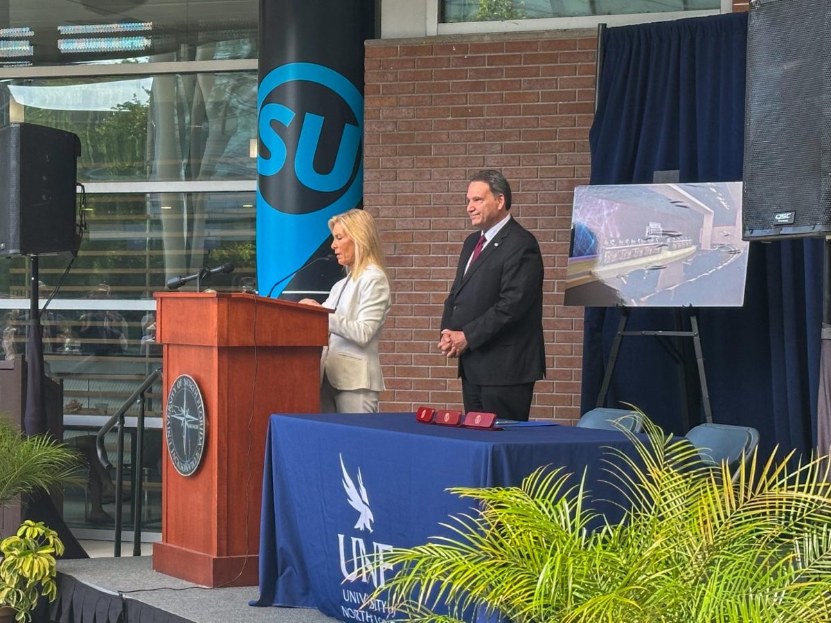Jacksonville Mayor Donna Deegan (left) and UNF President Moez Limayem (right) announcing the funding for the UNF Flight Deck. 